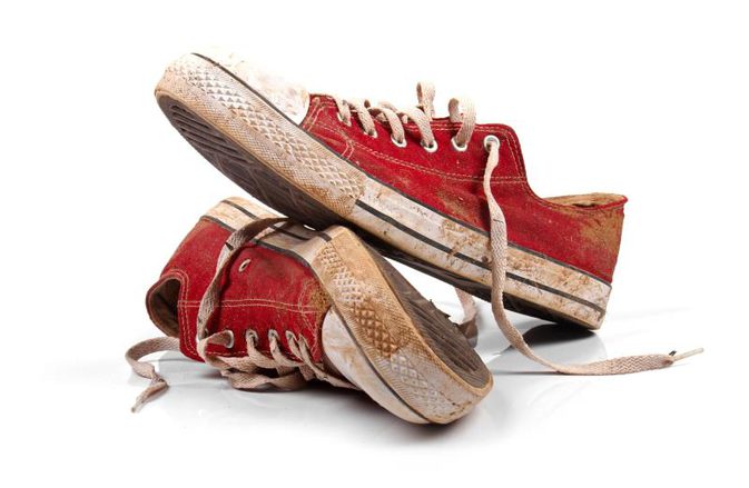 Shoes left at the door to prevent dirt, bacteria, and carpet damage inside the home