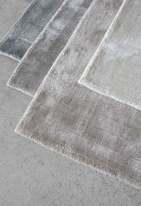 Close-up of viscose rugs also marketed as art silk and bamboo silk, showing shiny fibers that look like silk but wear out quickly.