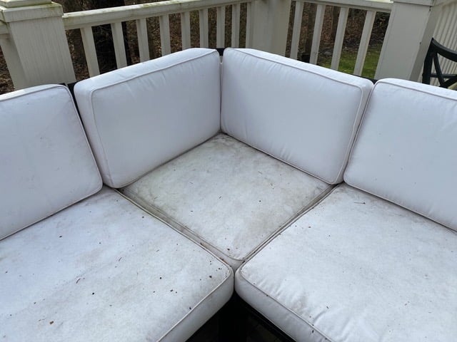 Dirty moldy outdoor patio cushions