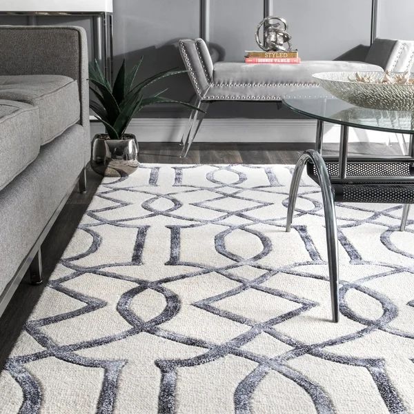 Premium modern upholstery cleaning and high-end geometric area rug care in a luxury home